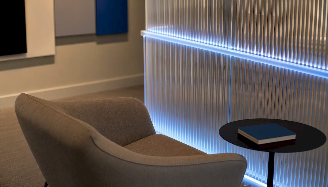 Slatted screen divider with lighting in studio