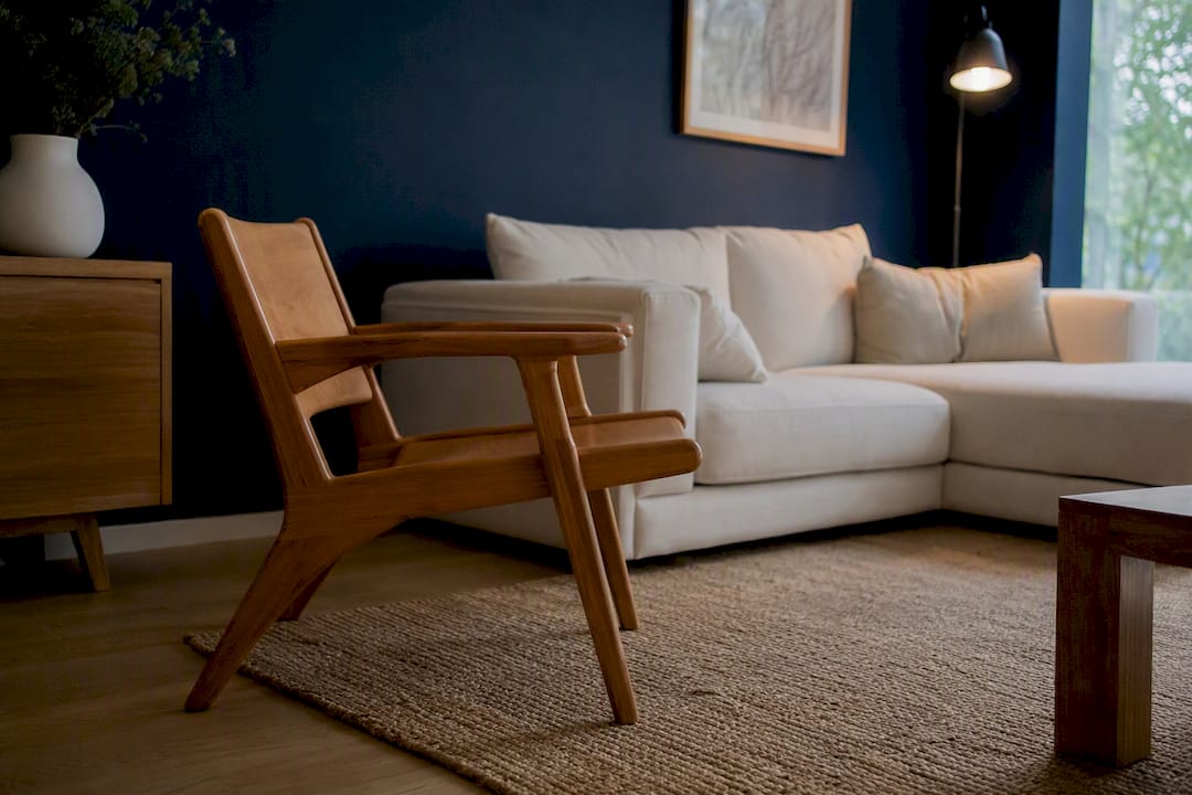 Moody wall with light wood furniture contrast