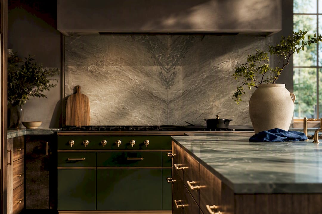 Luxury kitchen with green range and stone backsplash