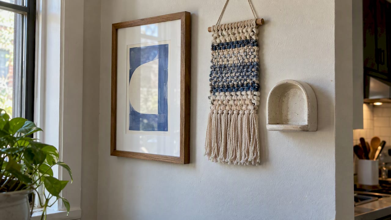 Print, woven hanging, and ceramic shelf together